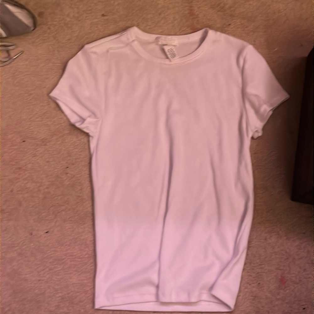 This shirt is from Tilly’s. It is a Small. It is 60% cotton and I never worn it.